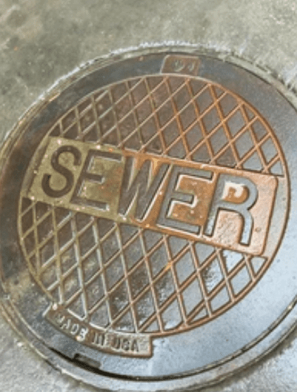 Manhole access to sewer; Con Edison can obtain contract to perform the work