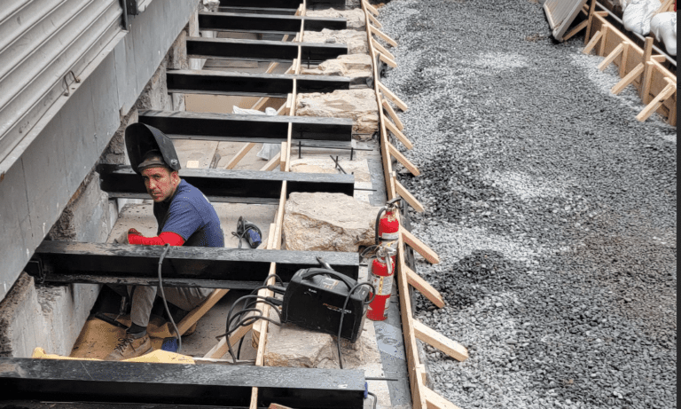 Vault Work In Progress Beyond The Building Line For Commercial Building: Welding Structural Members