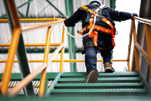 Osha Violations can be avoided if you wear a safety harness like this gentlemen pictured